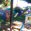East side of the yard.  We have slides, playhouse, climbing area, sand box, pond with fish (fenced off of course, but the childr