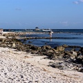 The boat dock and nearby rocky beach