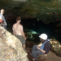Mark, Eric, and Travis with guide climbing into a cenote (sinkhole)