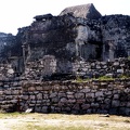 Ruins.  The thatched roof there is to protect some fragile part of the structure.