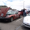 Car show the day before the race.  Please add comments to identify the cars and/or owners.