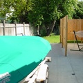 The boat on the extended pad from the new patio.  Hot tub and hammock on the far right.