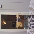 A better shot of the new screen door and view into master bedroom and partially dressed photographer.